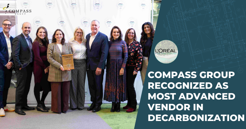 L'Oreal sourcing leaders present Compass leaders with a recognition plaque for decarbonization efforts.